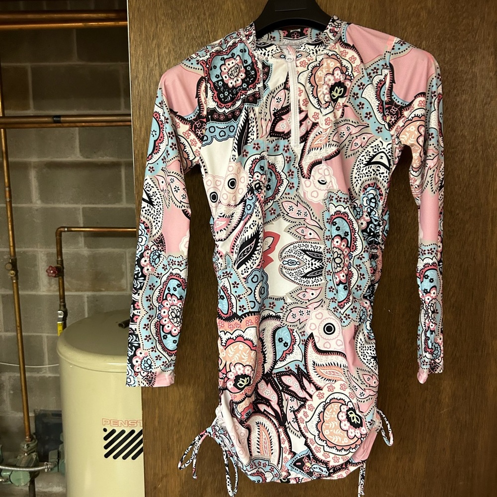 Rash guard has never been worn brand. New tags have just been removed.